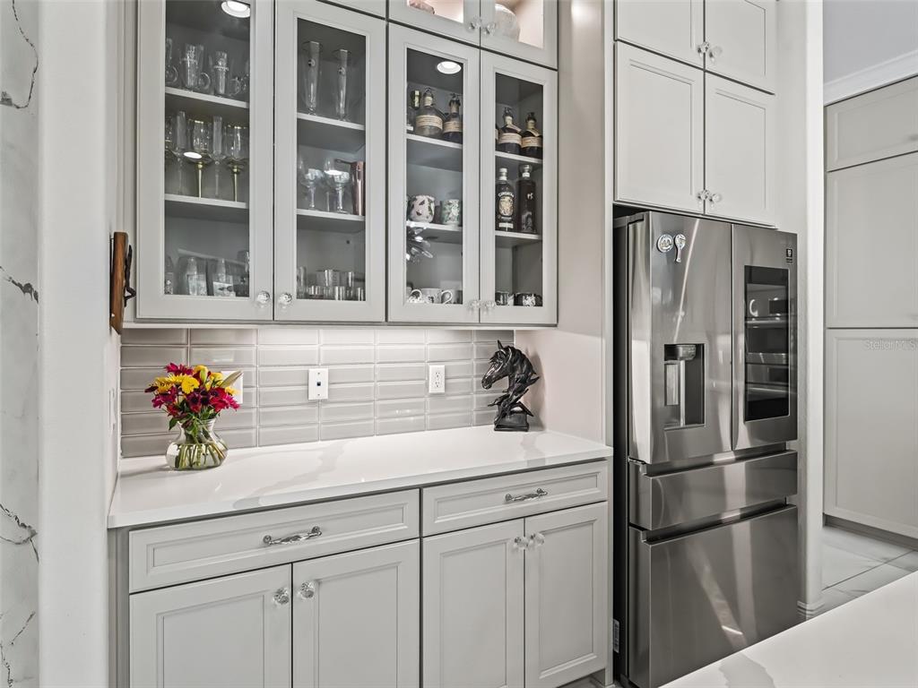 7161 Northeast 22nd Ct Road Ocala, FL 34479 - Photo 46 of 81 a kitchen with stainless steel appliances white cabinets and a refrigerator