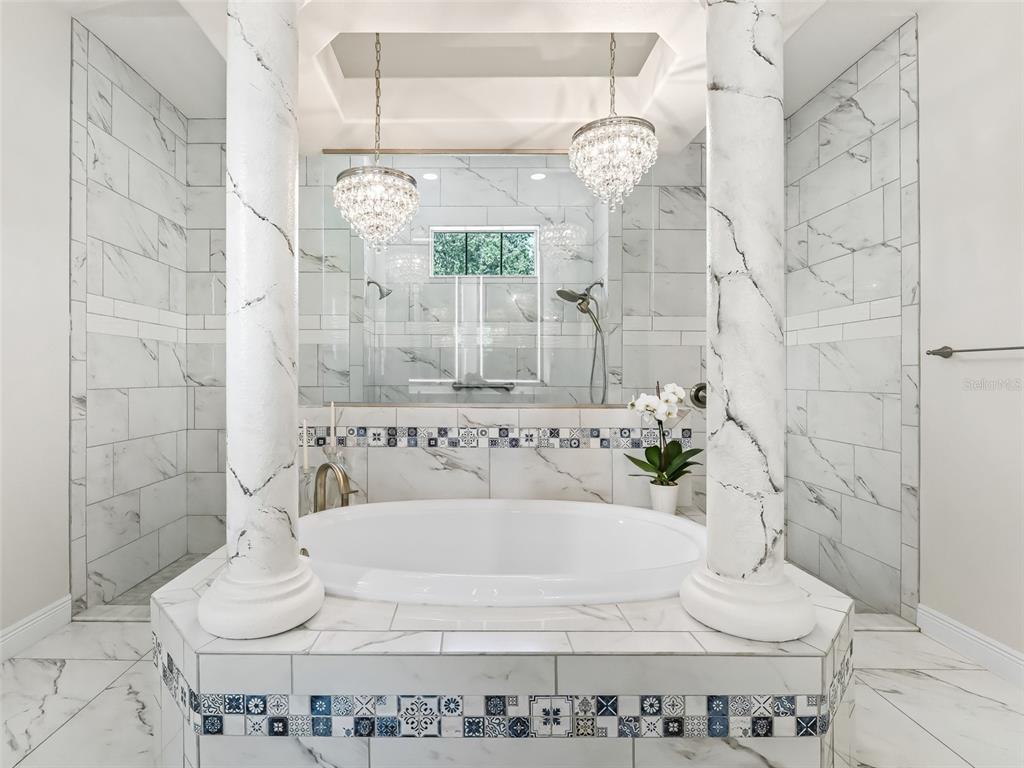 7161 Northeast 22nd Ct Road Ocala, FL 34479 - Photo 58 of 81 a bathroom with a bathtub