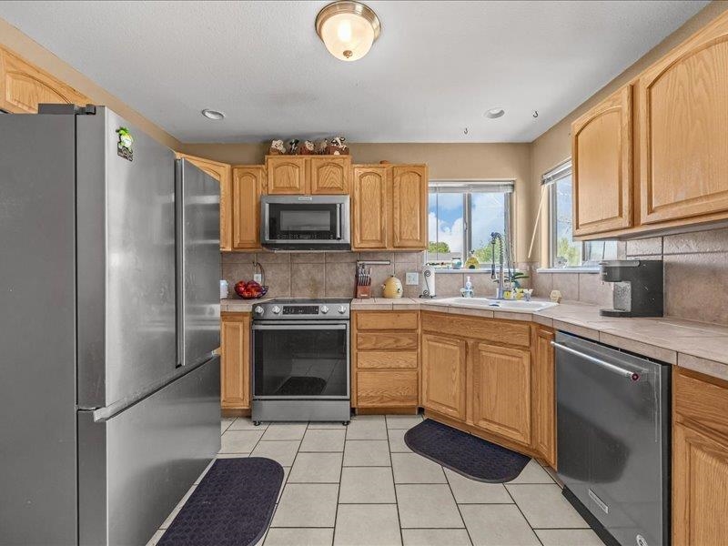 2860 B B 3/4 Road Grand Junction, CO 81503 - Photo 14 of 29 a kitchen with a sink appliances and cabinets