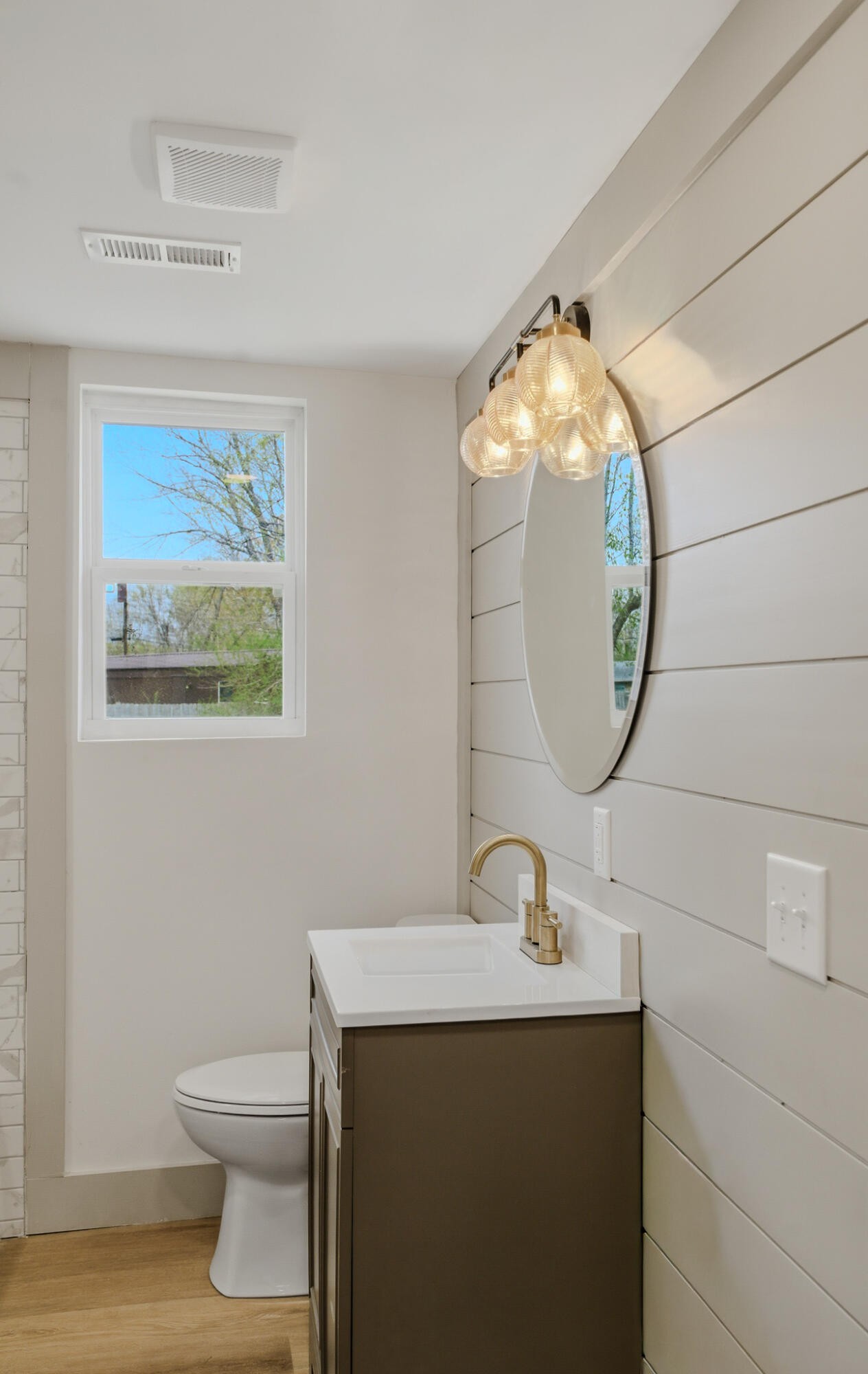 2317 Howell Street Cleveland, TN 37323 - Photo 11 of 39 a bathroom with a toilet a sink and a mirror