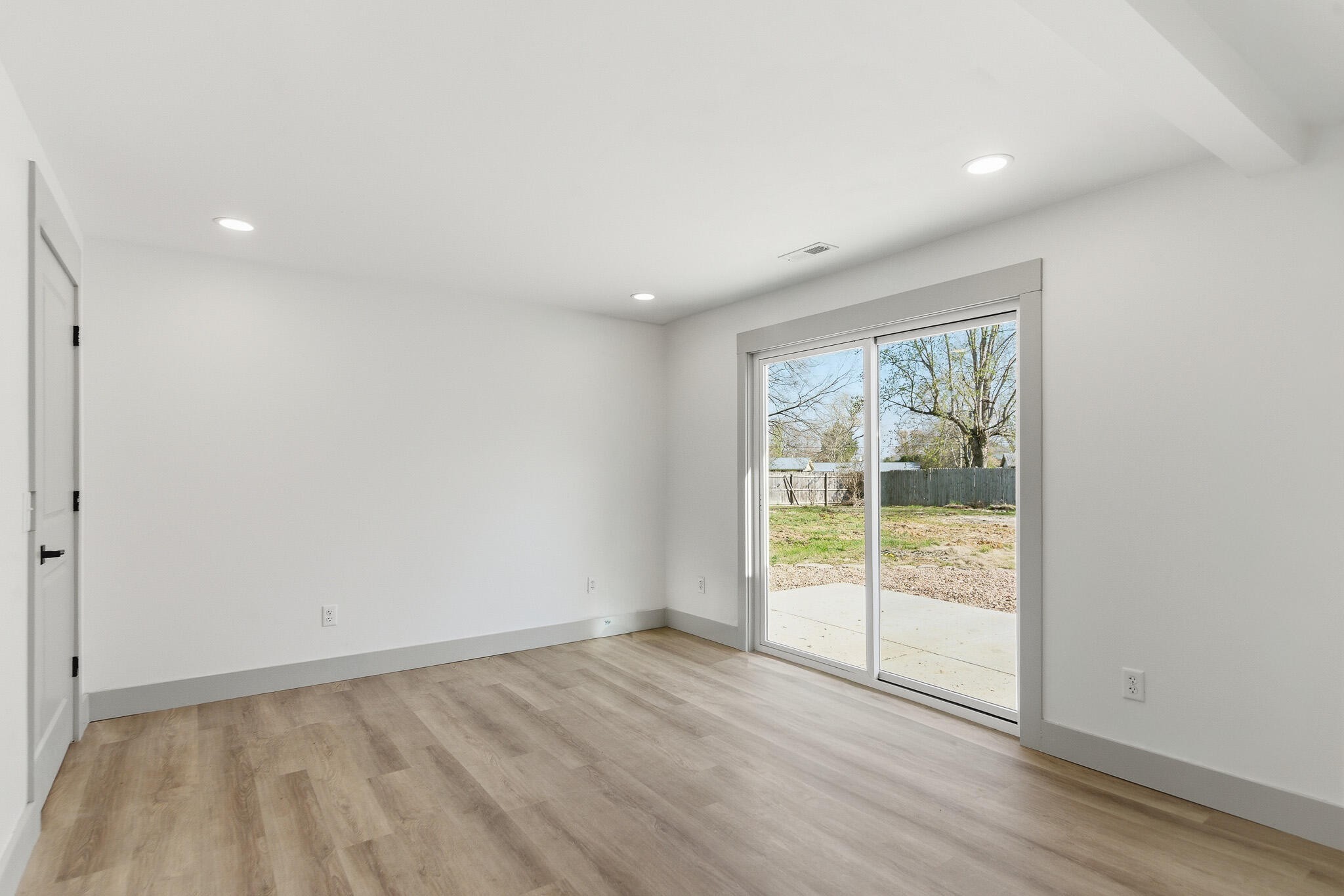 2317 Howell Street Cleveland, TN 37323 - Photo 23 of 39 a view of an empty room with wooden floor and a window