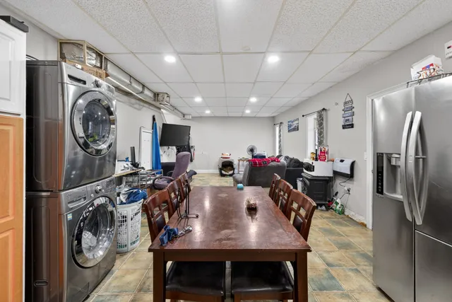 an aerial view of a house with garden space and sitting area
