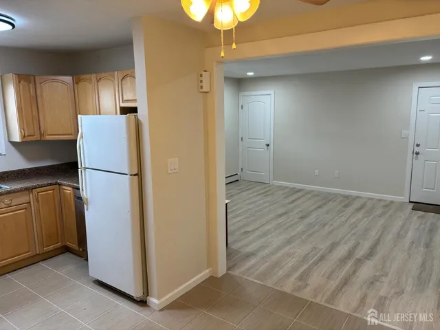 a view of hallway with wooden floor
