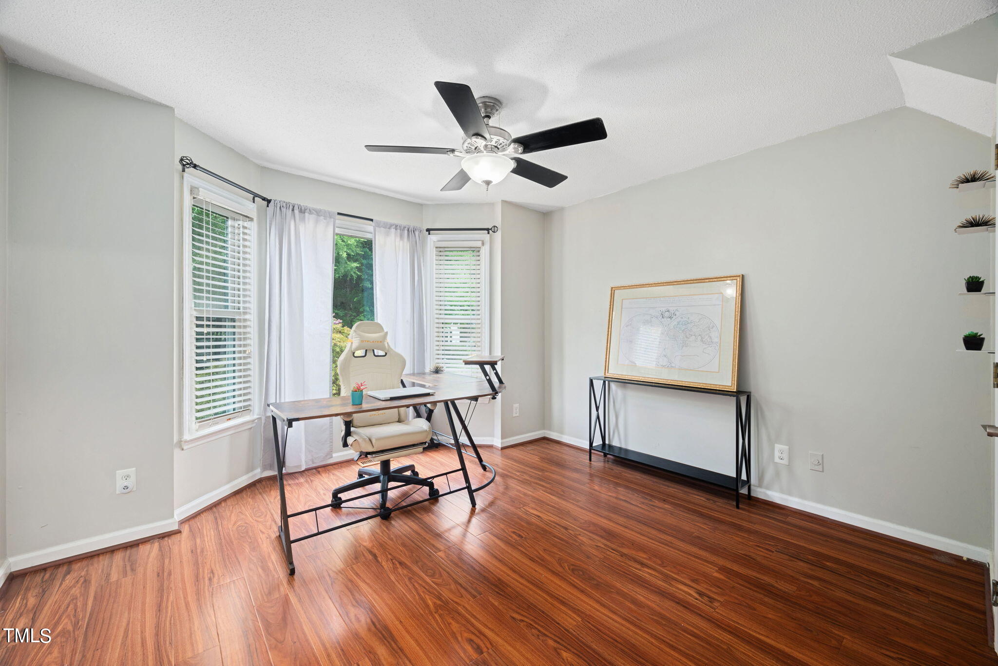 4400 Emmit Drive Raleigh, NC 27604 - Photo 13 of 38 a living room with furniture and a wooden floor