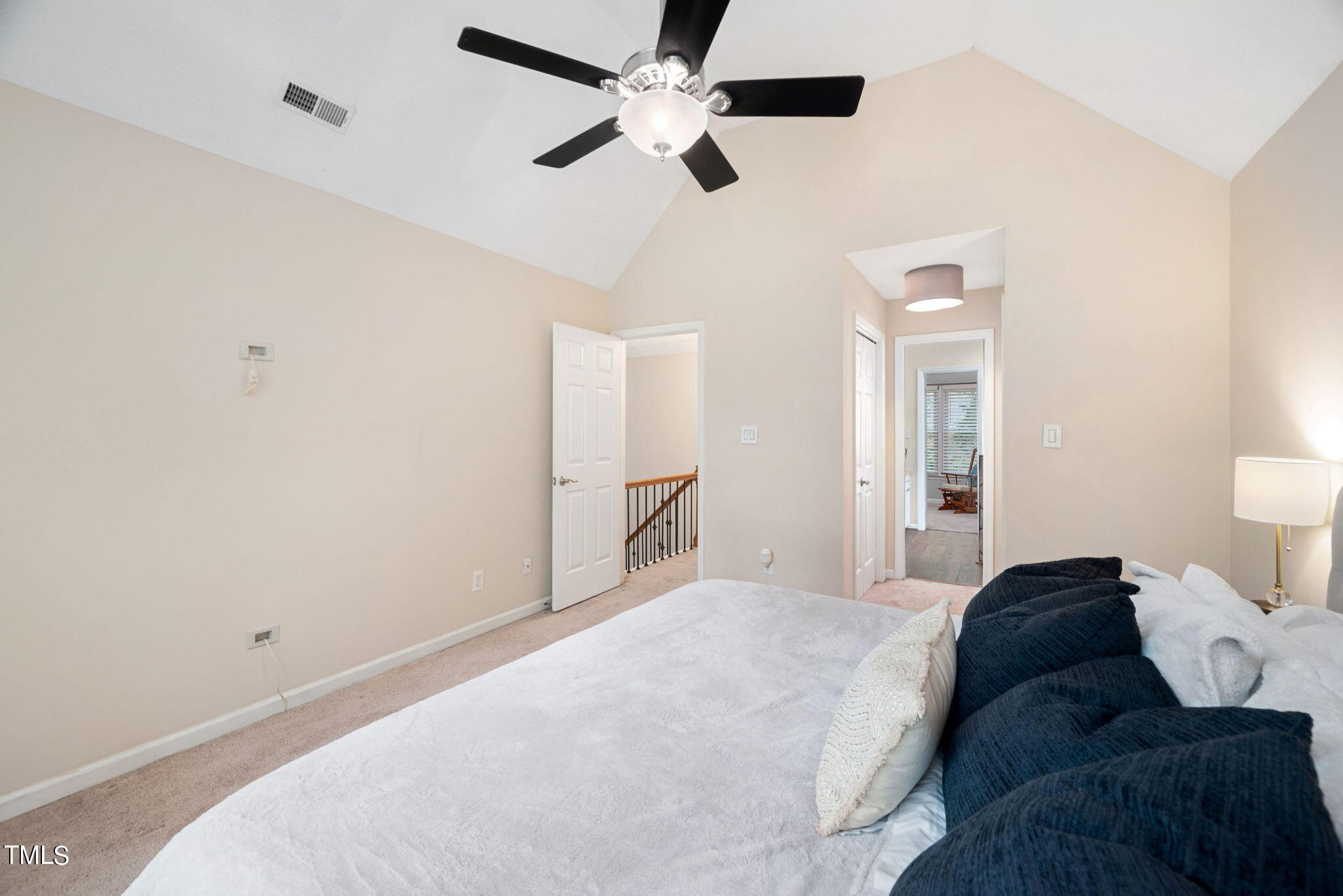 4400 Emmit Drive Raleigh, NC 27604 - Photo 16 of 38 a bedroom with a bed and a ceiling fan