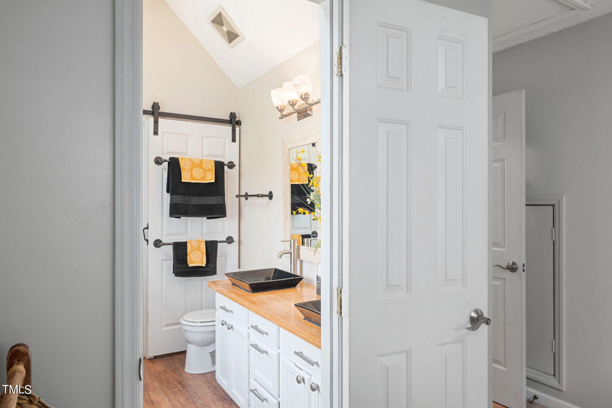 4400 Emmit Drive Raleigh, NC 27604 - Photo 20 of 38 a view of bathroom with a toilet sink and mirror