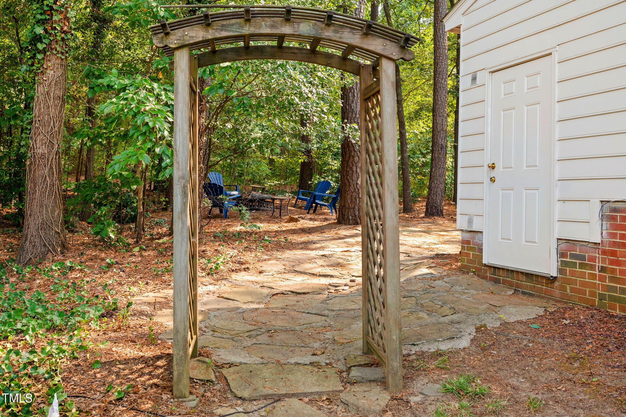 4400 Emmit Drive Raleigh, NC 27604 - Photo 26 of 38 a view of a porch with a floor to ceiling window and tree