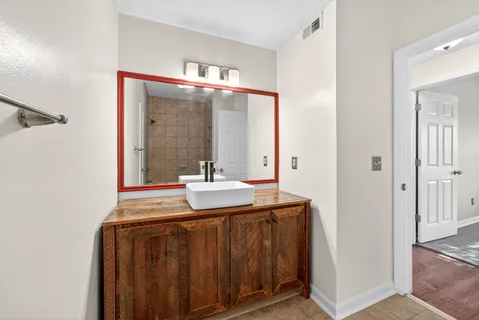 a bathroom with a sink and a mirror