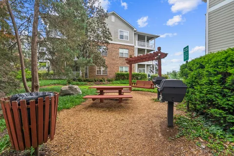 a swimming pool view with a outdoor seating