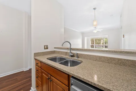 a kitchen with a sink and a window