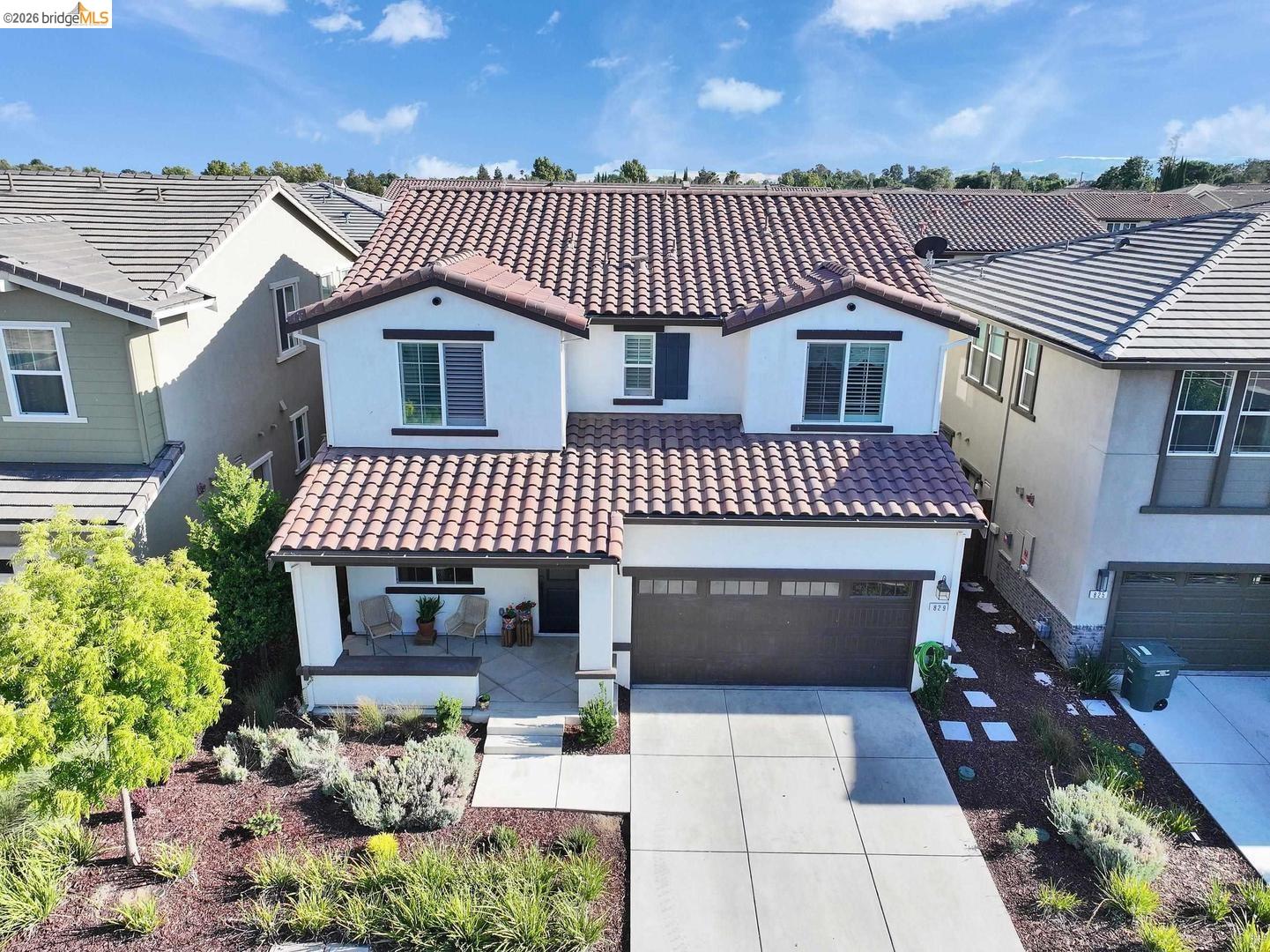 829 Hardcastle Ranch Road Oakley, CA 94561 - Photo 2 of 42 Two-story residence featuring a tile roof, covered front porch, attached garage, and landscaped front yard
