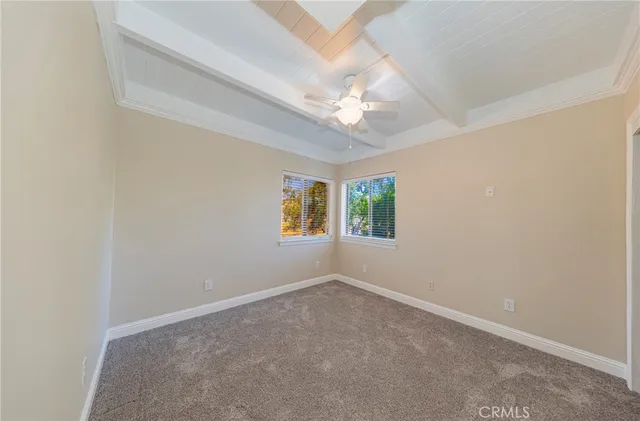 a view of livingroom with furniture ceiling fan and window