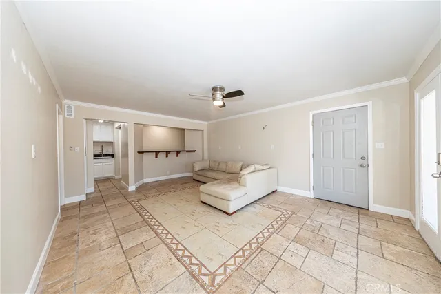 a view of kitchen with a sink and refrigerator
