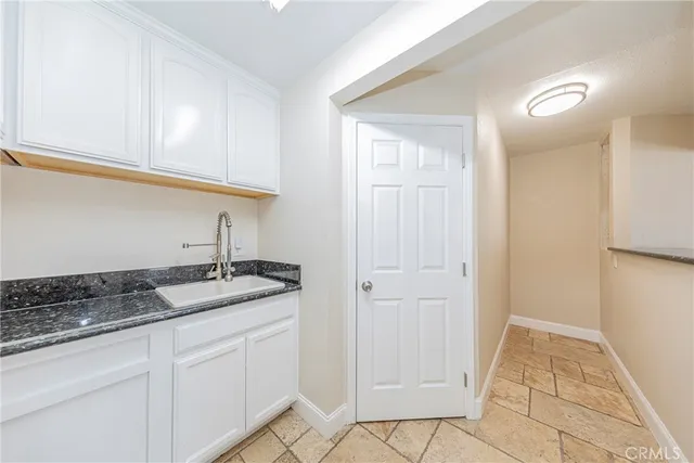 a view of a livingroom with a black and white checkered floor