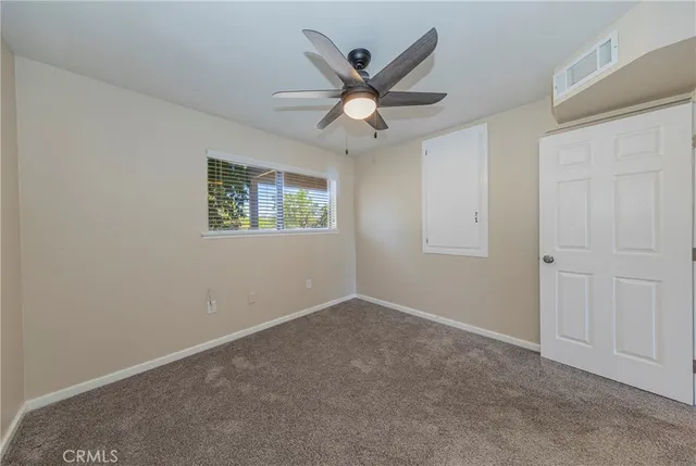 a view of a house with a tree