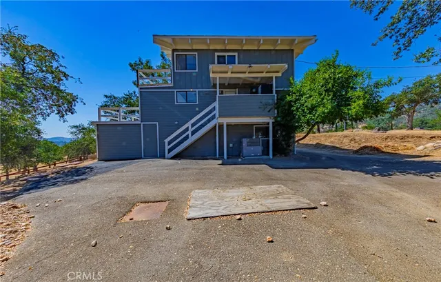 an aerial view of residential house and green space