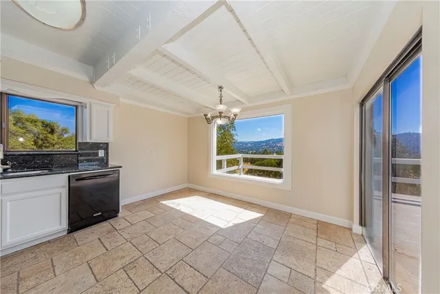 a kitchen with stainless steel appliances granite countertop a stove and a sink