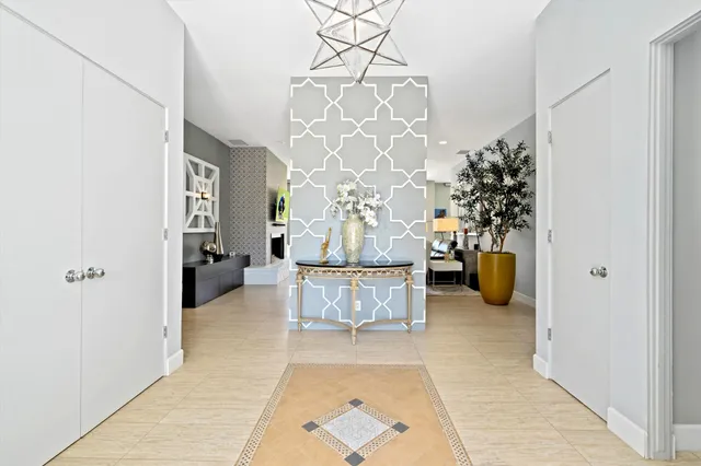 a bedroom with a bed mirror and window