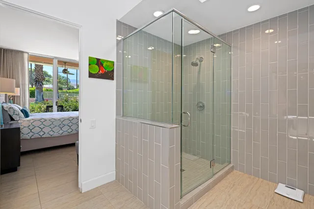 a bathroom with a tub a sink and mirror