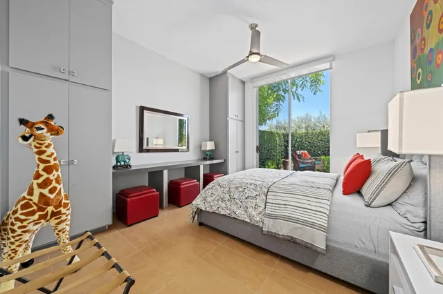 a view of a patio with a table chairs and a fire pit