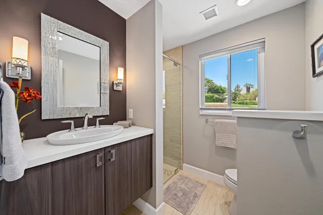 a view of a patio with a table chairs and a backyard