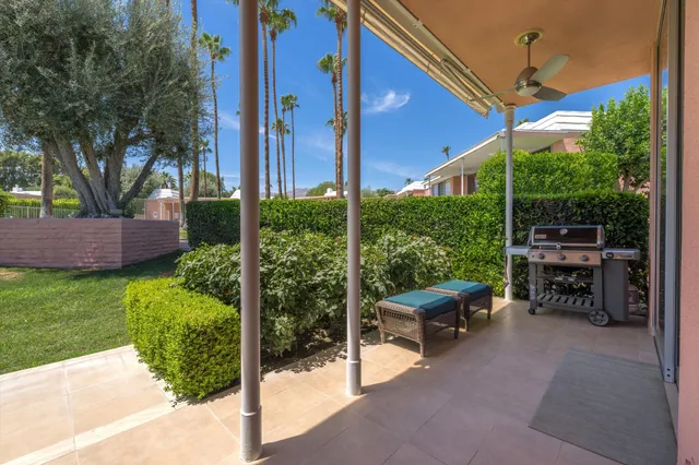 a view of a house with garden and sitting area