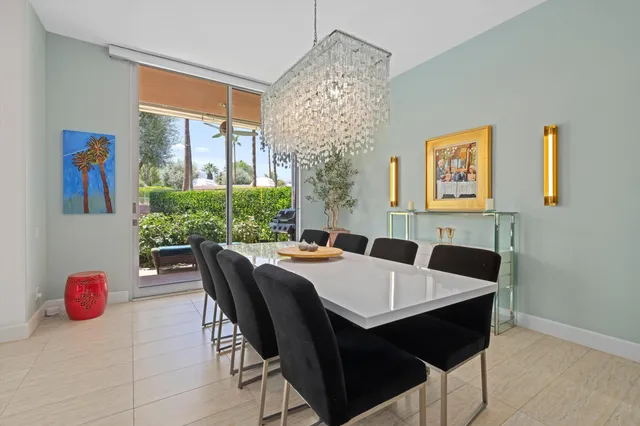 a view of a dining room with furniture wooden floor and a window