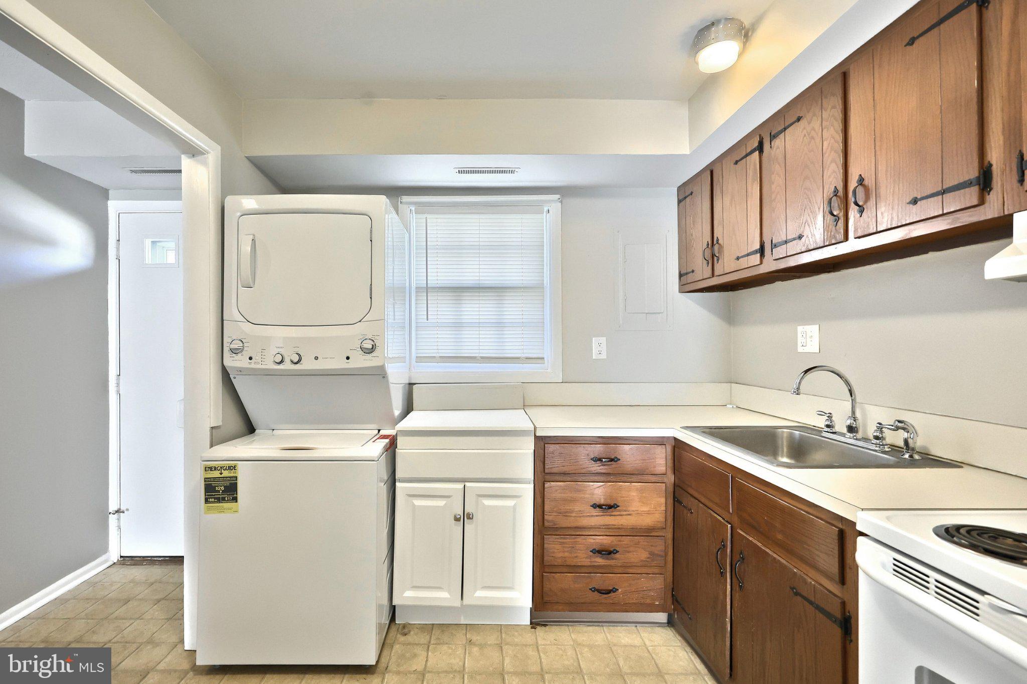 1714 Devers Road York, PA 17404 - Photo 8 of 26 a utility room with cabinets washer and dryer