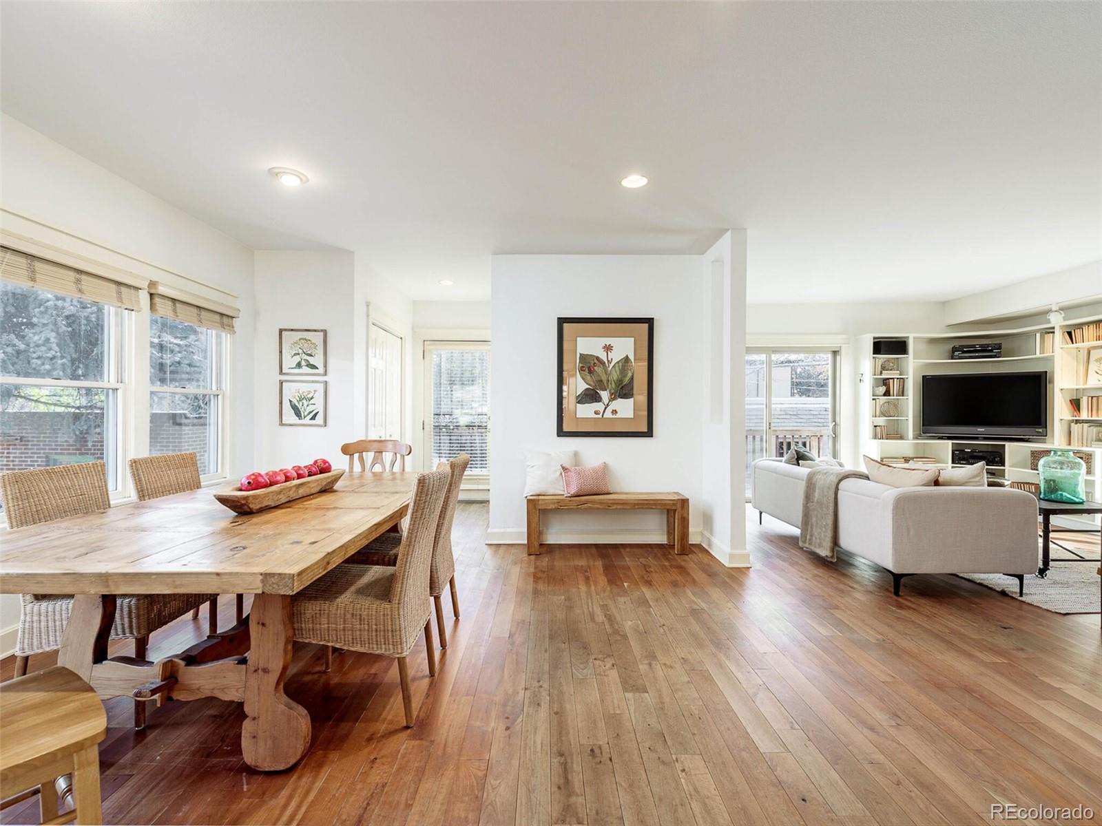 655 Gilpin Street Denver, CO 80218 - Photo 11 of 29 a view of a dining room with furniture and wooden floor