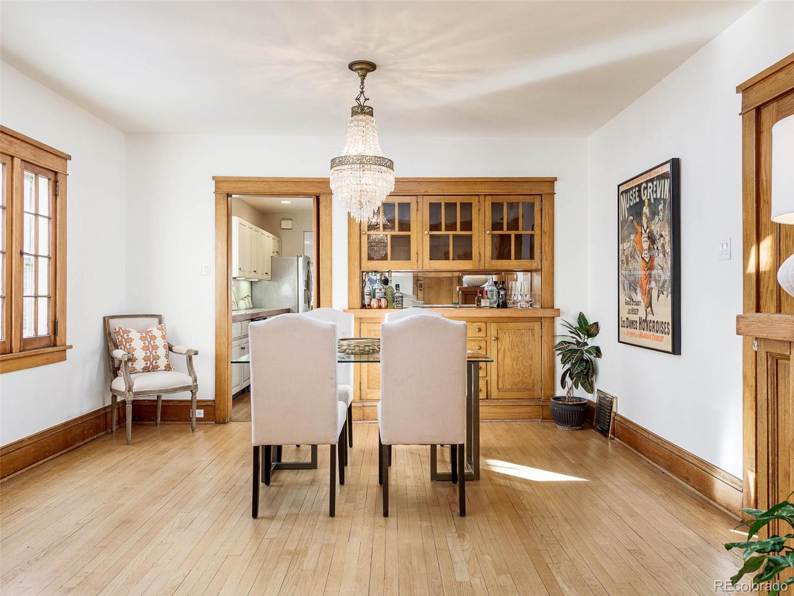 655 Gilpin Street Denver, CO 80218 - Photo 7 of 29 a view of a dining room with furniture window and wooden floor