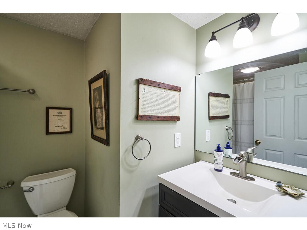 1123 South Hametown Road Akron, OH 44321 - Photo 12 of 37 This is the guest bath located in the hall of the first floor. It has been updated with newer vanity, counter top, faucet, tub surround and marble floor.