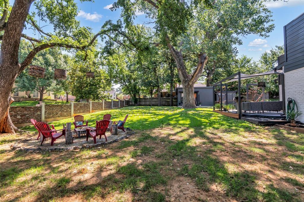 3449 West T Parr Road Grapevine, TX 76051 - Photo 28 of 32 a view of a house with backyard and sitting area