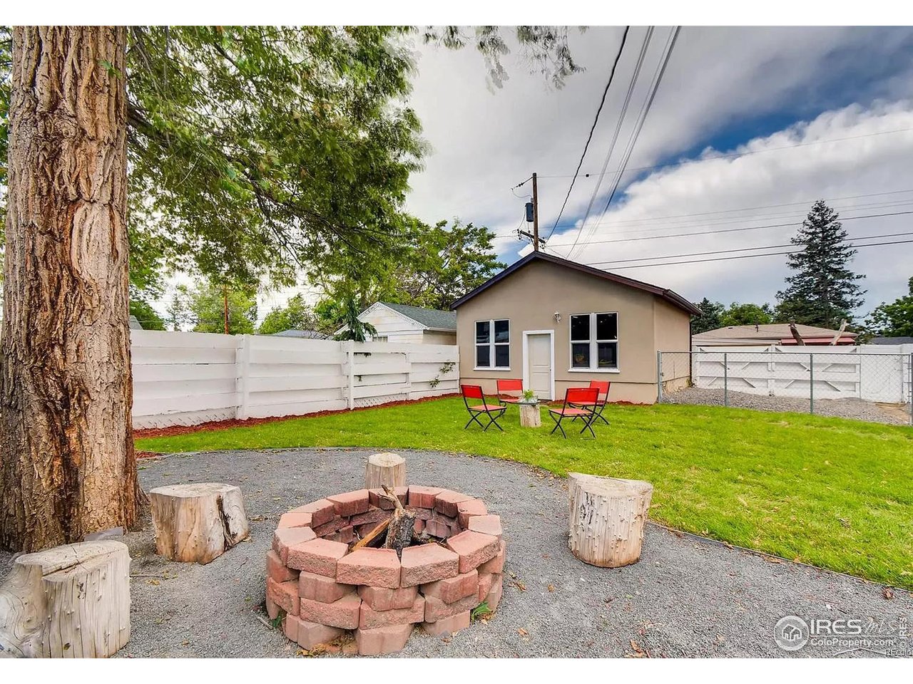 4870 Irving Street Denver, CO 80221 - Photo 19 of 19 a house view with a backyard space and garden