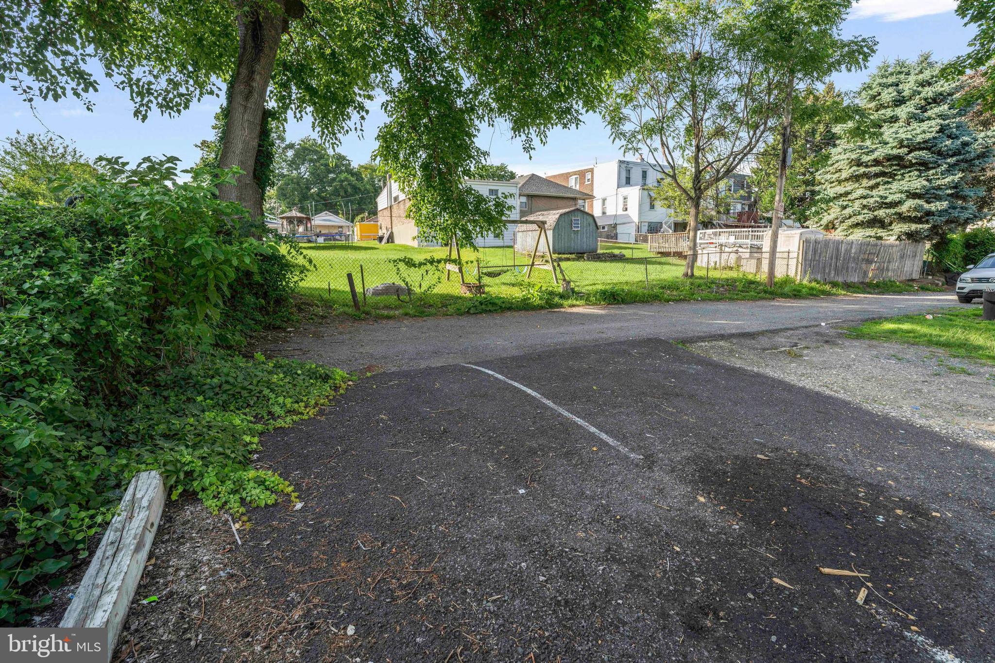 132 West Ridge Road Marcus Hook, PA 19061 - Photo 24 of 26 a view of a road with plants and trees