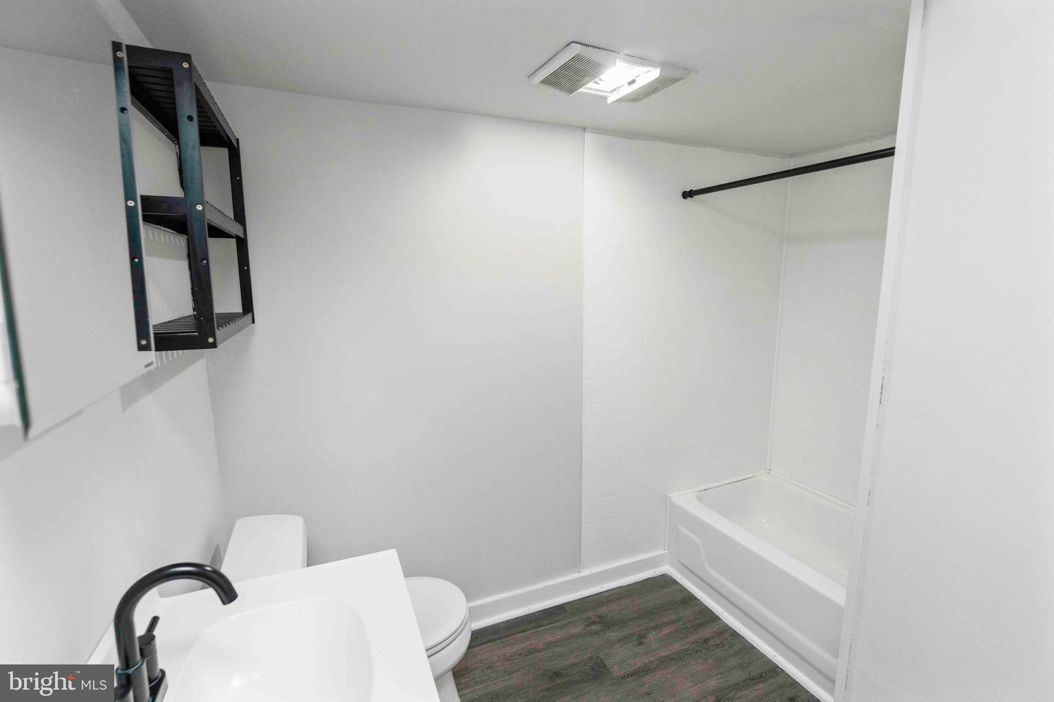 132 West Ridge Road Marcus Hook, PA 19061 - Photo 7 of 26 a bathroom with a bathtub and shower