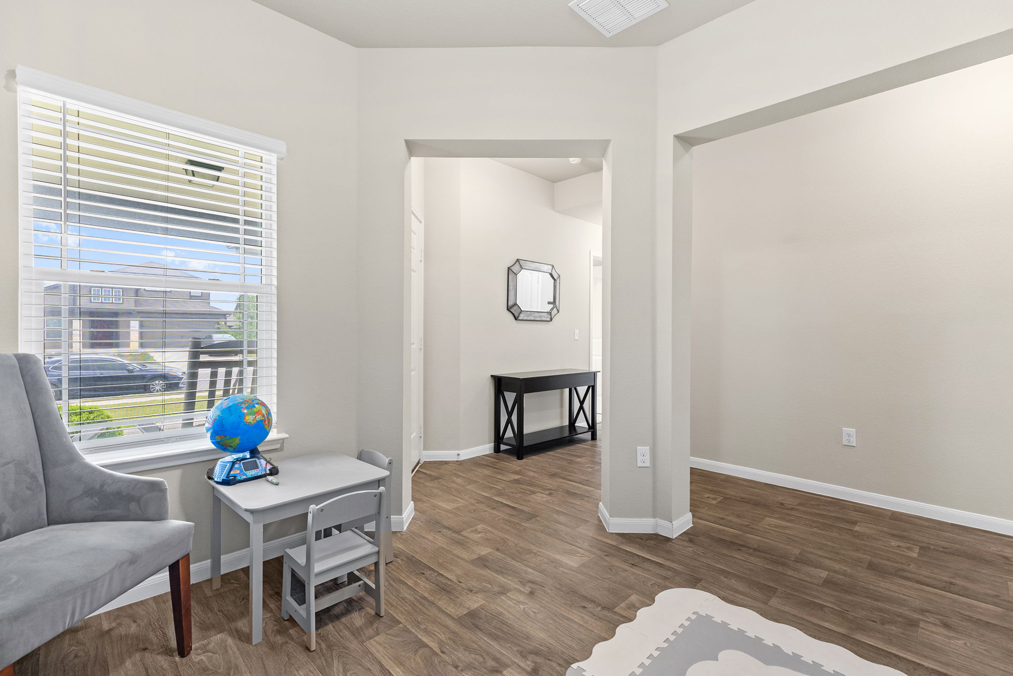 404 Cassandra Drive Hutto, TX 78634 - Photo 32 of 40 Sitting room with dark wood-style floors and baseboards