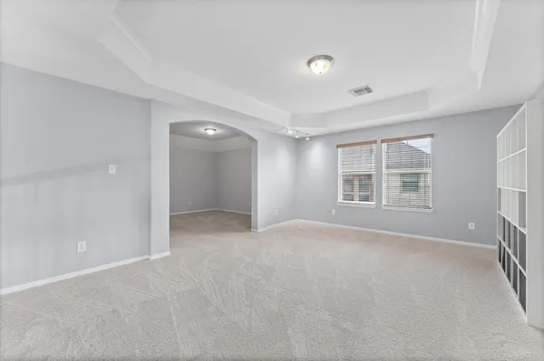 a view of an empty room with a window