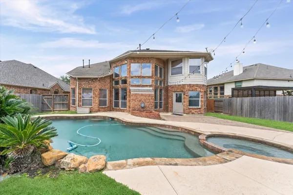 a view of a house with a swimming pool