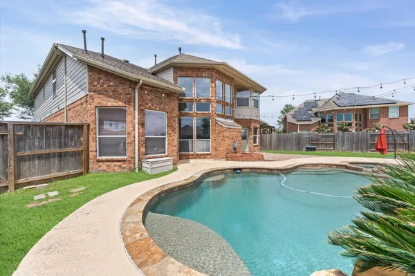 a view of a house with a swimming pool