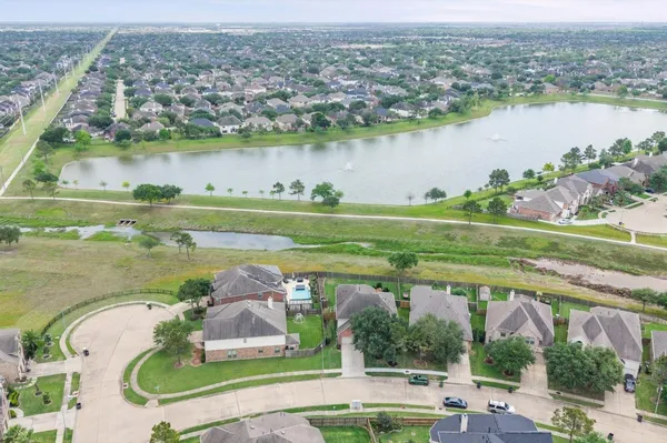 an aerial view of a house with a lake view