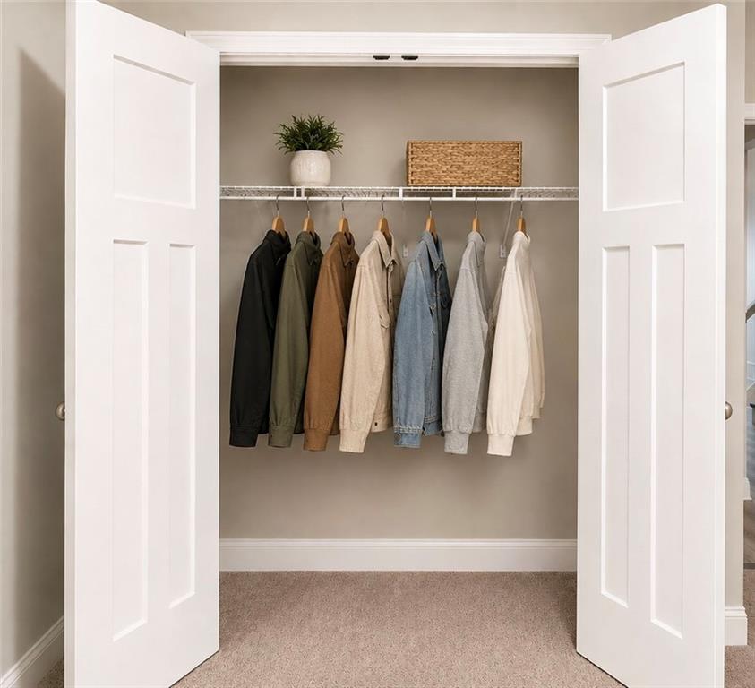 3359 Elkhorn Ridge Run Dacula, GA 30019 - Photo 13 of 35 a view of walk in closet with clothes