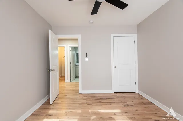 a kitchen with a sink a refrigerator and cabinets