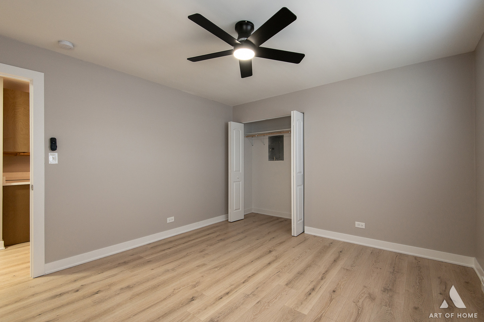 14924 Indiana Avenue Dolton, IL 60419 - Photo 37 of 73 an empty room with wooden floor and a ceiling fan