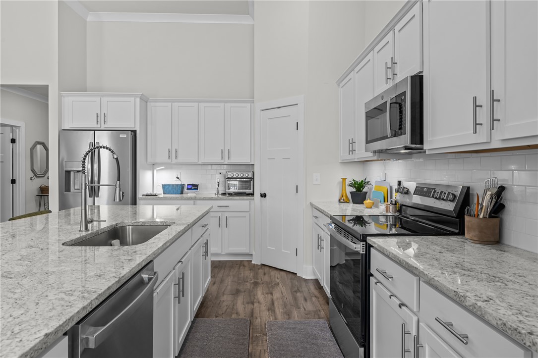 135 Bowers Estates Road Hartwell, GA 30643 - Photo 9 of 35 This bright kitchen features ample counter space and modern appliances, perfect for everyday living.