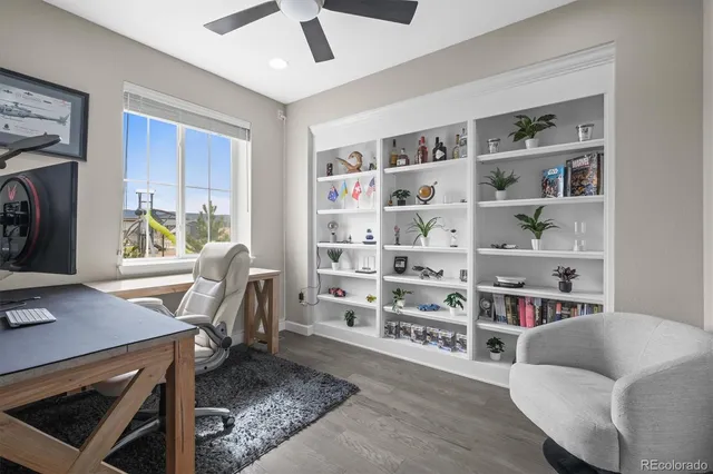 a living room with granite countertop furniture and floor to ceiling windows