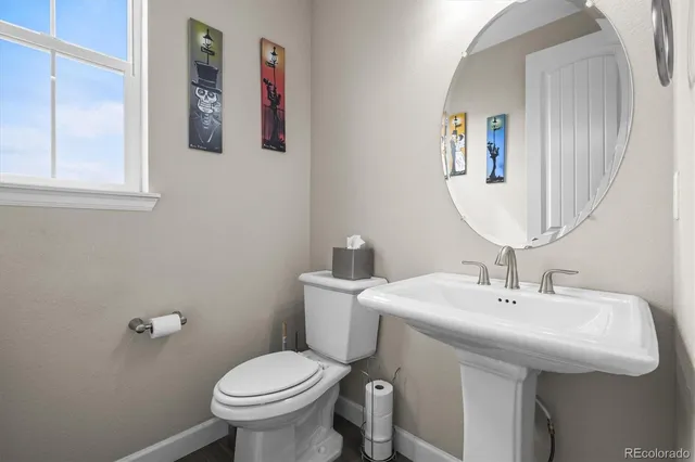 a view of living room kitchen with stainless steel appliances granite countertop living room and couch