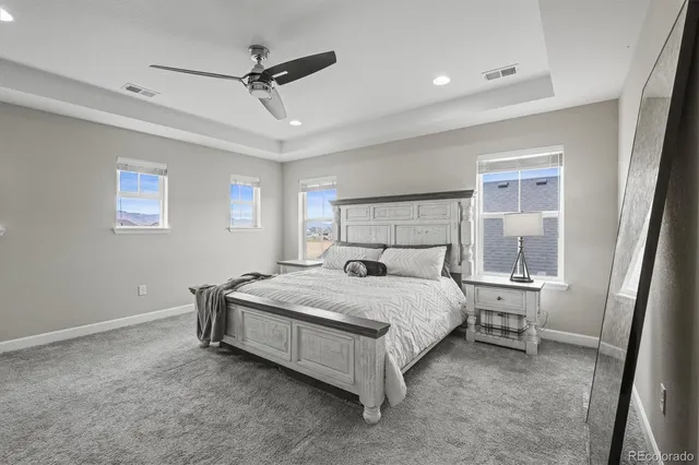 a spacious bathroom with a double vanity sink a mirror and a shower