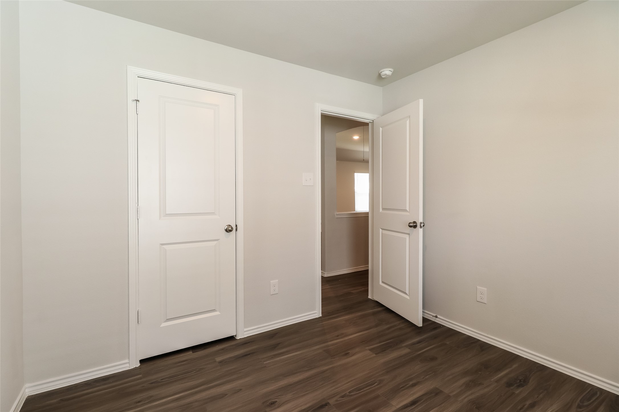 2465 Carp Drive Conroe, TX 77384 - Photo 15 of 18 an empty room with wooden floor & closet area