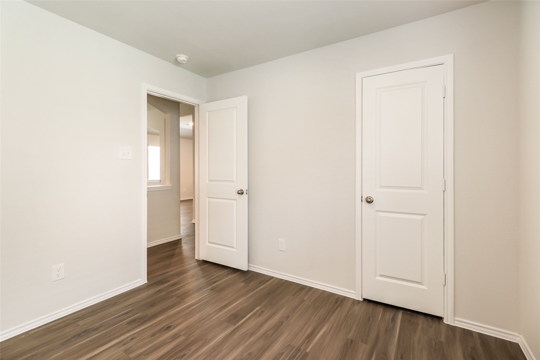 2465 Carp Drive Conroe, TX 77384 - Photo 16 of 18 a view of empty room with wooden floor