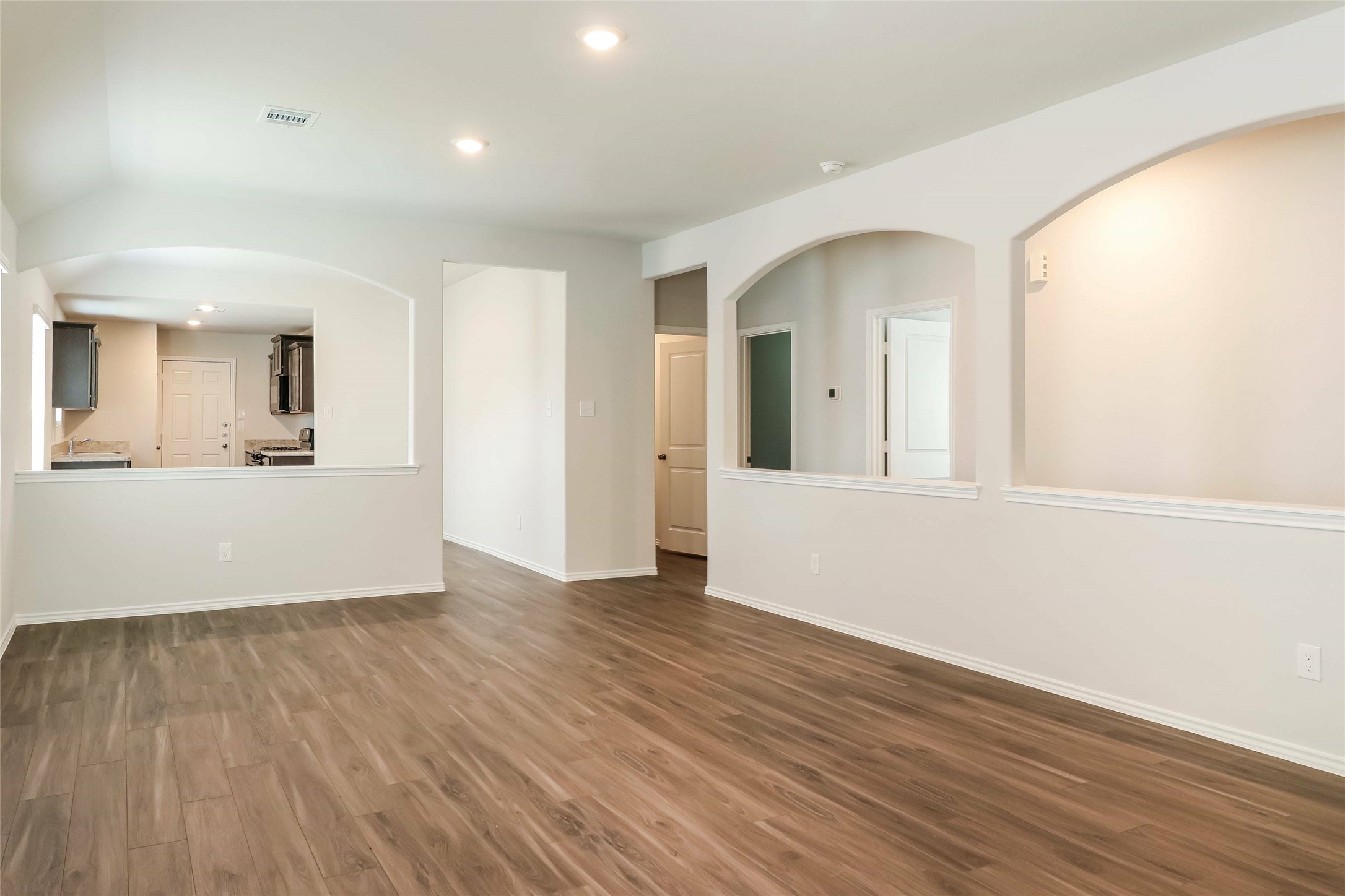 2465 Carp Drive Conroe, TX 77384 - Photo 9 of 18 wooden floor in an empty room with a window